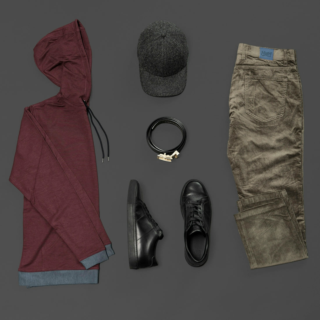 red textile beside black leather boots