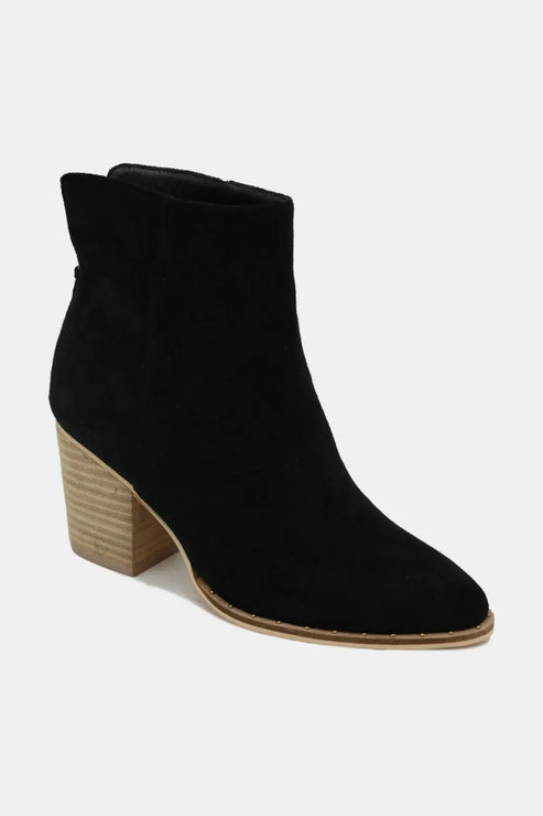 Assorted women's footwear collection: heels, flats, boots, and sneakers in tan, black, blue, and orange.