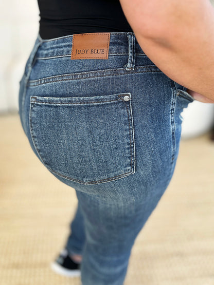 Judy Blue Full Size Mid Waist Distressed Slim Jeans – Uneeque Designzz